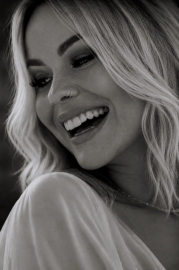 Black-and-white portrait of Heather smiling